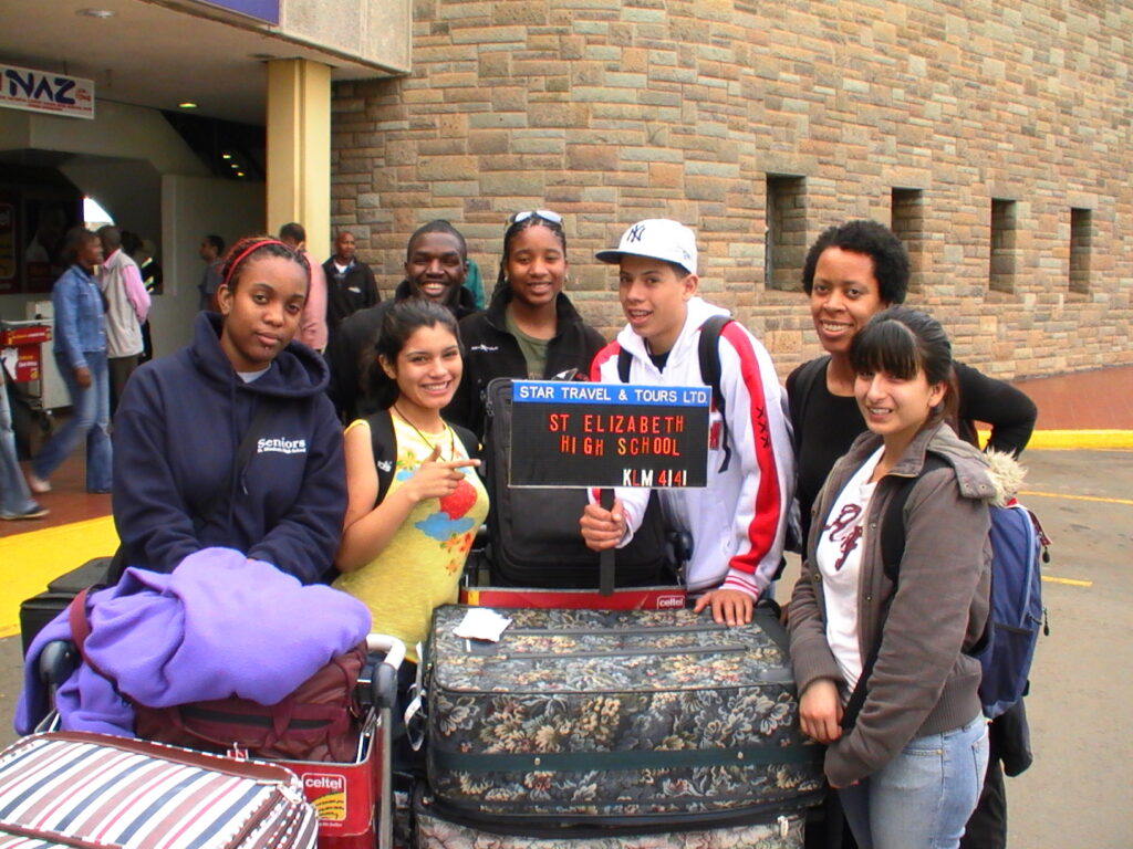 Other Paths founder Christina Berlin with the students from Oakland CA St Elizabeth High School at JKIA Airport Kenya 2007