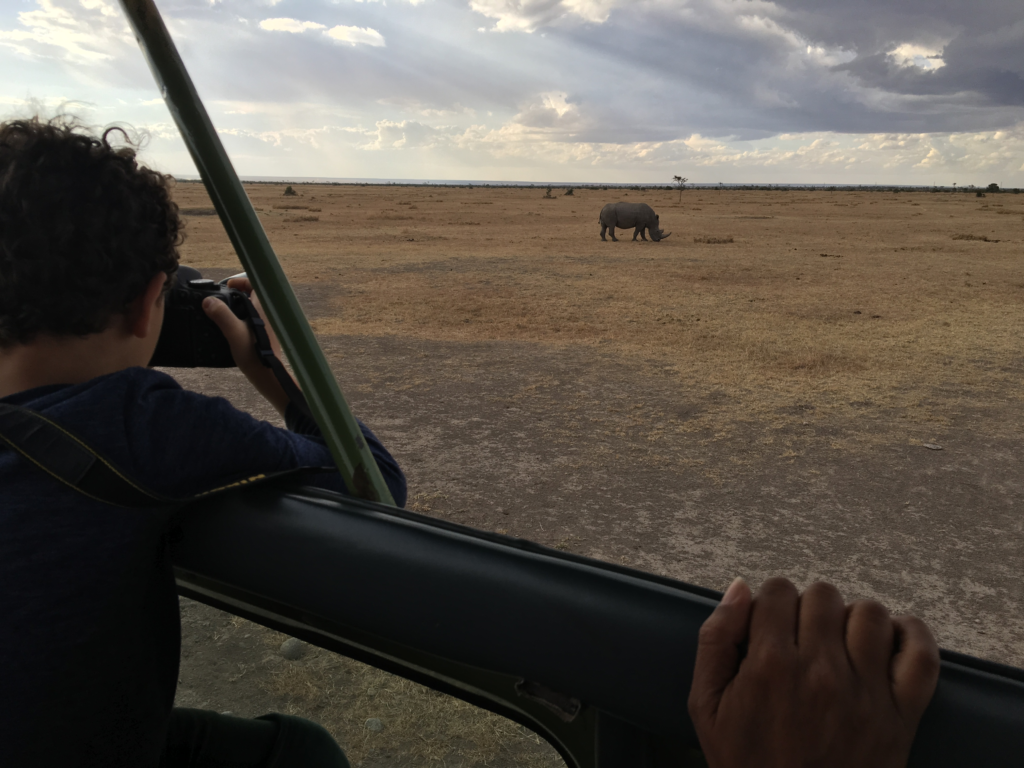 Matthew taking a photo of a rhino in Ol Pejeta Conservancy Kenya